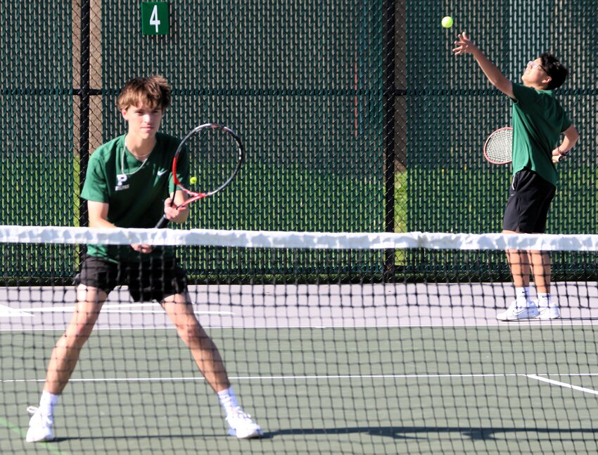 Park&rsquo;s Ethan Lo serves as teammate Matt Petersen plays up at the net at No. 2 doubles Friday. Lo and Petersen won 6-4, 6-4.