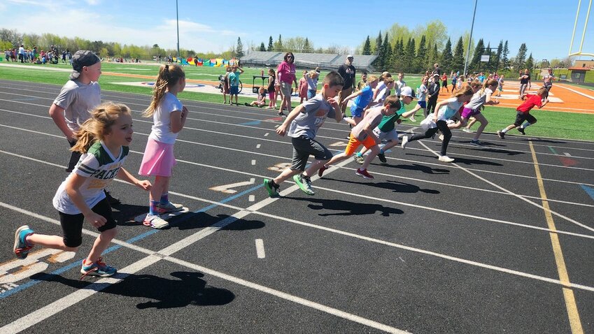 SB students in Kindergarten through Second Grade rotated through seven different stations displaying skills learned throughout the year in Physical Education. Some stations demonstrated teamwork while others showed individual skills. Here students participated in the 400-meter dash.