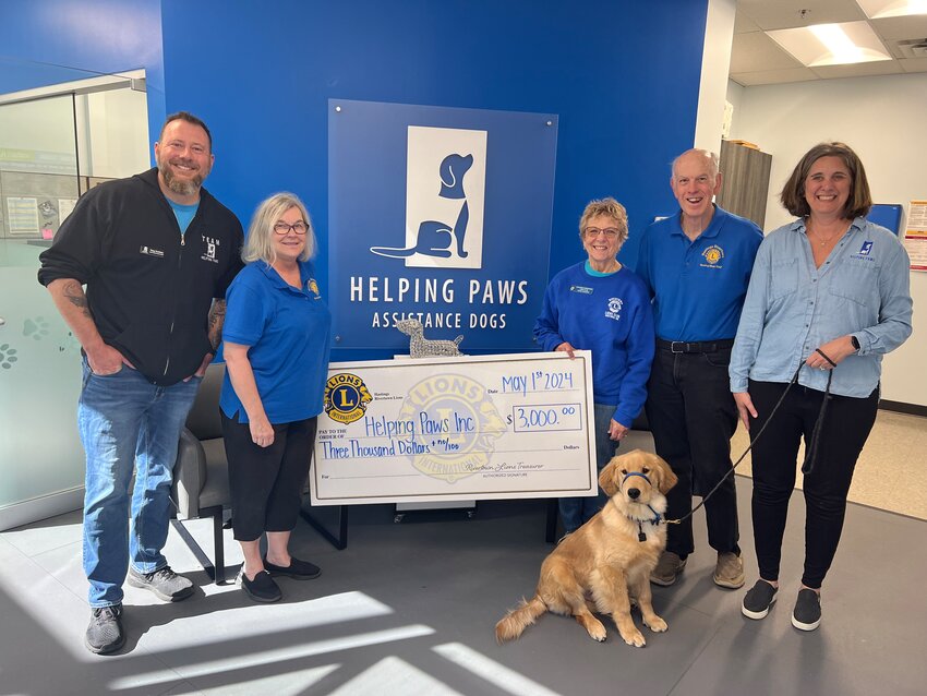 The Lions presented a $3,000 donation to Helping Paws. From left are Tony Craidon of Helping Paws, Hastings Rivertown Lions Linda Molenda, Joann Vaughn and Mike Molenda, and Alyssa Golob of Helping Paws.