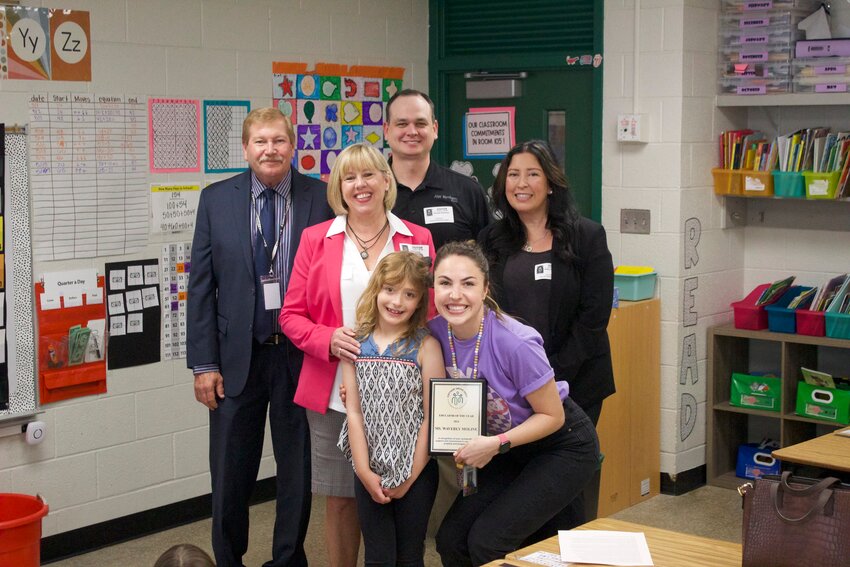 2024 Educator of the Year Waverly Moline joins student Kaia Beyer in accepting the honor Monday morning. Pictured with them are (from left) South Washington School Director of Finance and Operations Daniel Pyan, Cottage Grove Chamber President Laurie Levine, Randy Bachman from Merchant’s Bank and Holly Schmidt from Associated Bank.