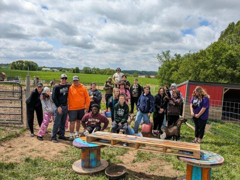 Ellsworth High School students went to Elsie&rsquo;s Barnyard to help construct a play area for the goats.