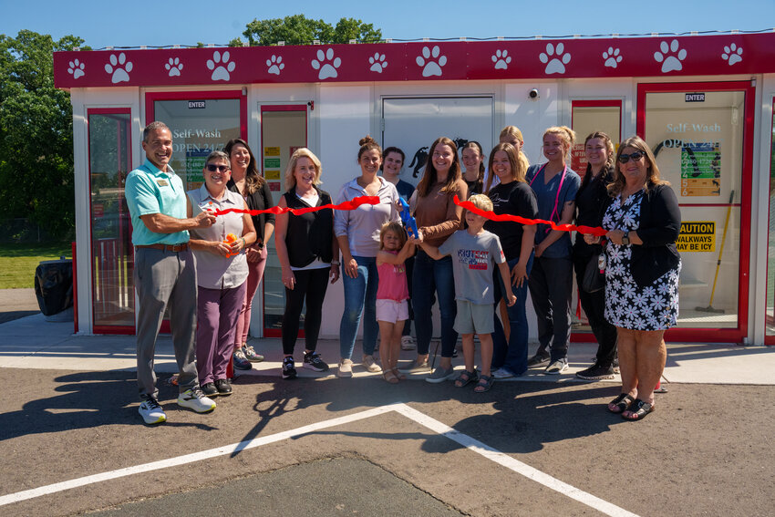 The staff at Rio Grooming School and Salon with members of the Hastings Area Chamber of Commerce gathered for the ribbon cutting celebrating the 24-hour self-serve dog washes located at the Rio campus.