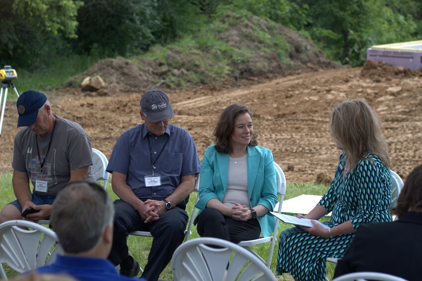 Lt. Gov. Sara Rodriguez and St. Croix Valley Habitat for Humanity Executive Director Kristie Smith share speeches on affordable housing at a build site in River Falls on June 11.
