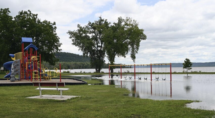Flooding of the Mississippi River has overtaken Saratoga Park and the Bay City Campground, as pictured on Saturday, June 29. It looks like children will have to wait to swing or play basketball.
