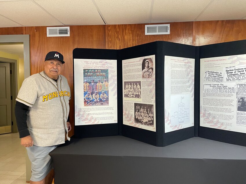 Author Frank White alongside part of the black baseball exhibit at the Sibley Historic Site.