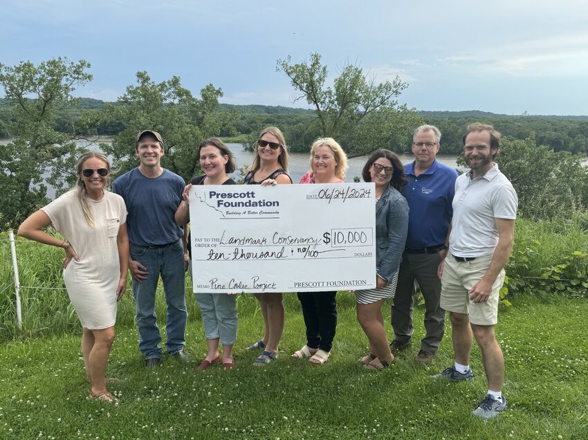 Pictured are (from left):  Kim Unser with Prescott Foundation; Rick Remington and Kristin Thompson with Landmark Conservancy; Amanda Johnson, Joan Korfhage, Lindi Steffan and Rick Murphy all with Prescott Foundation, and Jared Schmitz with Freedom Park.