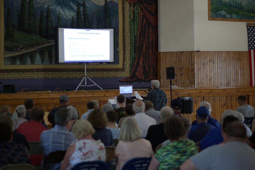Hundreds of citizens packed the Elmwood Auditorium during a public DNR hearing about Ridge Breeze Dairy's expansion application on July 11.