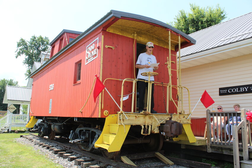 Lee Kaschinska stood where many a politician may have done in the past and shared history of the restored caboose.