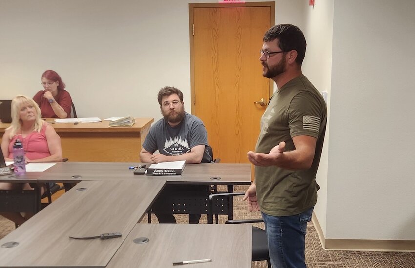 Matt Goettl of Central Care Transport, LLC. (center) presented his new business to the Stanley Council at the July 15 regular meeting.