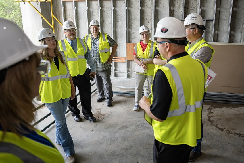 Alan Symicek, UW-River Falls chief facilities officer, describes how construction is progressing on the university&rsquo;s Science and Technology Innovation Center (SciTech) during a tour of the building Tuesday. Business and government leaders toured the three-story building, which is under construction and is scheduled to open in January 2026.