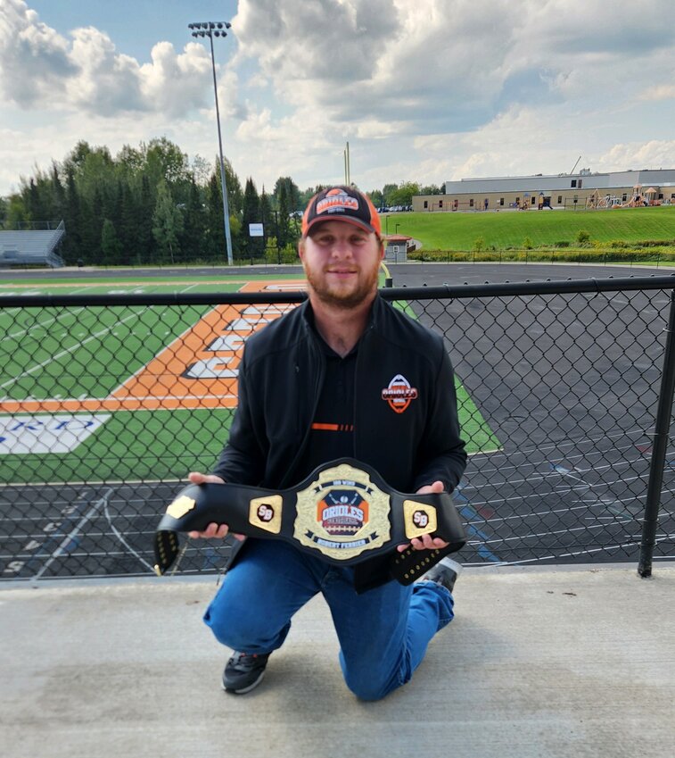 Robert Ferrier has been a member of the Stanley-Boyd Orioles Football Team since 2013. Here he displays his personalized commemorative belt from the 100th win.