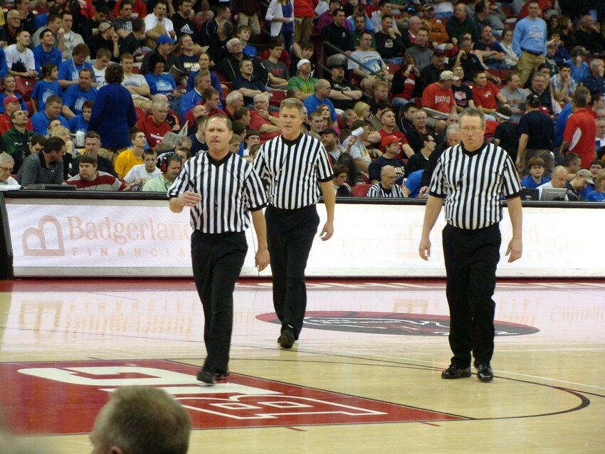 Three of our local officials leaving the court after a job well done at the boys state tournament.