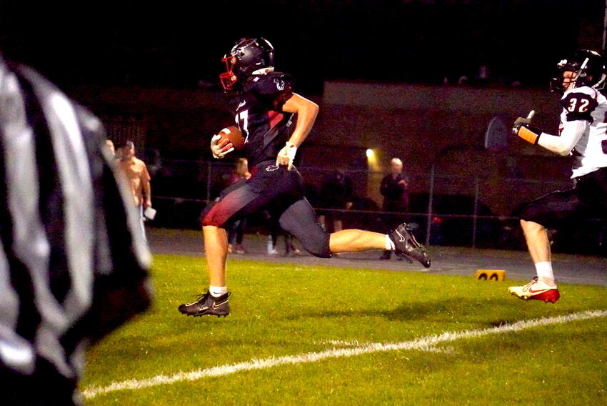 The Blackhawks defense meets the Alma Center Lincoln Hornets near the goal line.