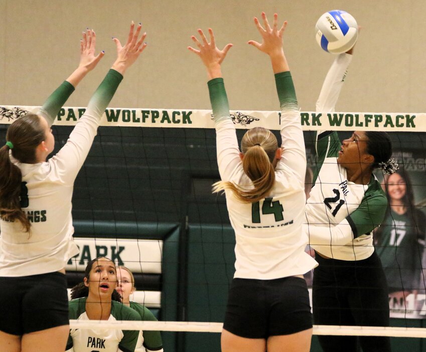 Park’s Sonja Lind sends a hit past a pair of Mounds View defenders in game three Thursday.