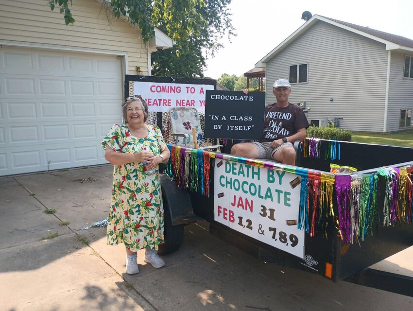 Great River Road Theatre Director Judy Johnson and member Scott Halverson advertise their next production, 