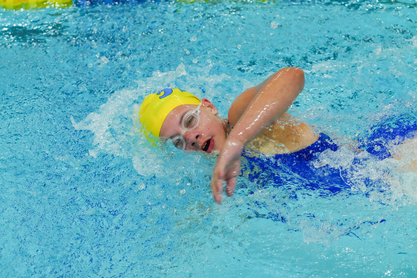 Against the co-op team of the So. St. Paul/Minnehaha/Cristo Rey Loons, some junior varsity swimmers were brought up to swim in varsity races. Here, eighth grader Elayna Latch (left) swam the butterfly leg of the 200-medley relay, and seventh grader Emilia Krause (right) swam the freestyle leg of the 200-medley relay on her birthday!