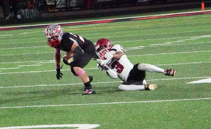 After going down 20-0 early in the second quarter, the Prescott Cardinal defense did not fold. Determined to stop the Blackhawk attack and start clawing back, the Prescott defense stormed on the field with a renewed vigor. #3 Kobe Russell (left) made an athletic stop on the BW runner before #11 Owen Bayer and #16 Cole Platson came together to make stops for no gain.