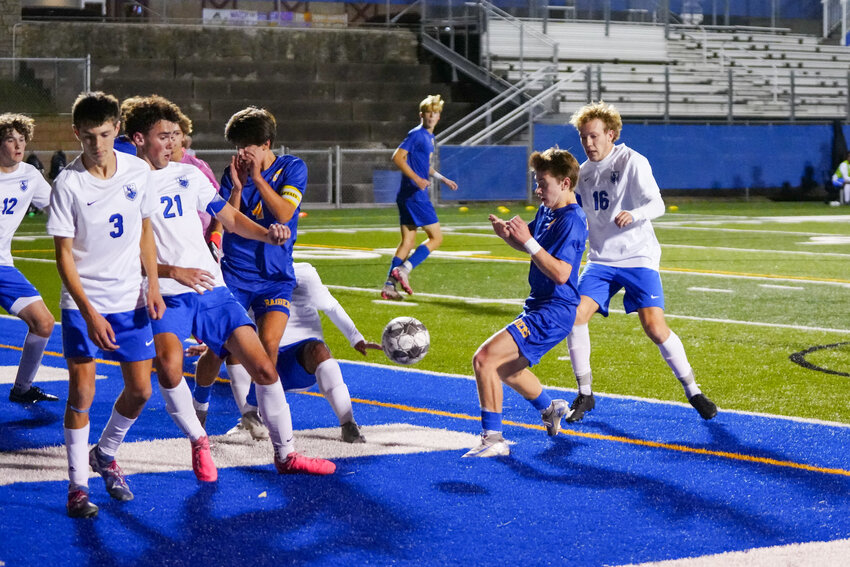 Proof that creating chaos in front of the soccer goal creates scoring opportunities, both first Raider goals of each game on Tuesday were scored off corner kicks. On the left, Jersey Appert scores for the girls and on the right Parker Geib scores for the boys.