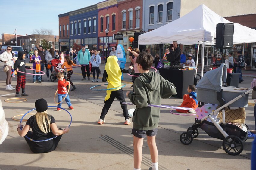 Costumed children played games and ran from stall to stall collecting candy during the Halloween Candy Crawl.