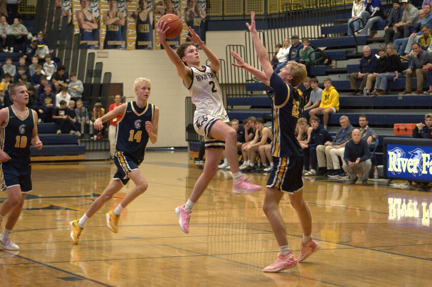 Brody Graetz takes on a defender on the fastbreak in a 23-point performance to beat Mahtomedi on Dec. 6.
