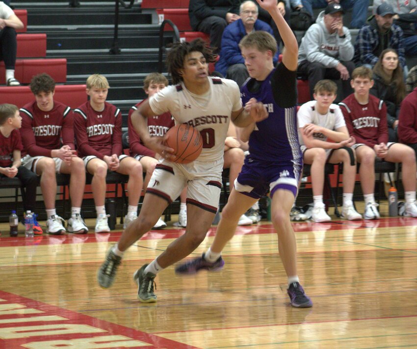 Prescott junior Kobe Russell drives baseline in a Jan. 21 win over rival Ellsworth. Russell finished with 26 points.