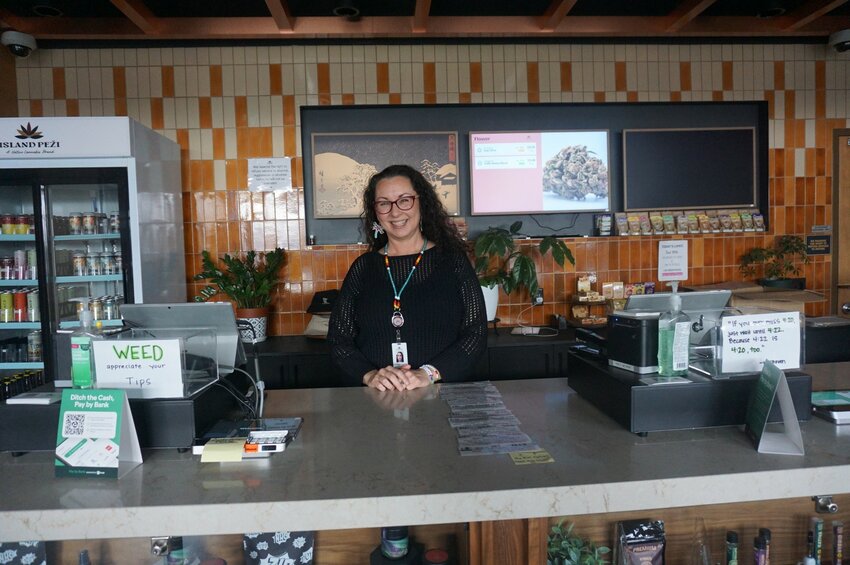 Treasurer of Prairie Island CBH, Inc. Kim Campbell behind the counter of Island Peži, Prairie Island Indian Community&rsquo;s cannabis dispensary that opened in July 2024.