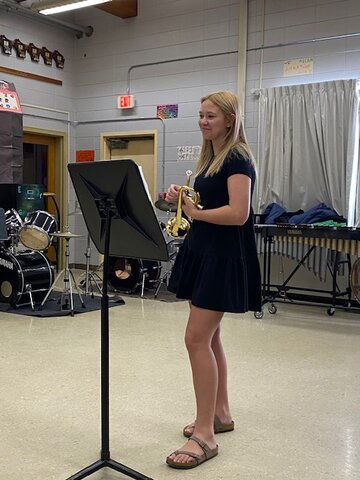 Evelynn Olson listens to the judge&rsquo;s critique after her trumpet solo.