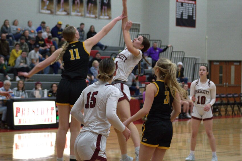 Nora Boles banks a floater over the Northwestern defender in a 51-42 playoff win Feb. 28
