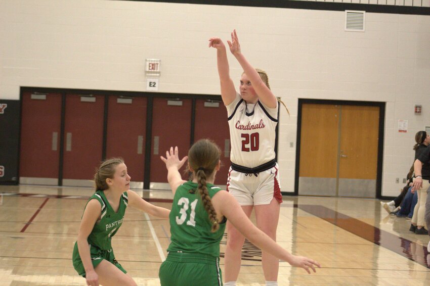 Freshman Jada Hoolihan shoots from deep as a pair of defenders close out during a 44-21 win over Prairie Farm on Feb. 25.