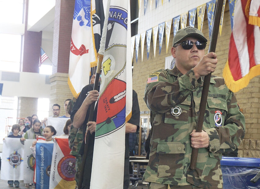 The presentation of flags, led by native veterans, presented the 11 Tribal flags before hanging them in the high school commons.