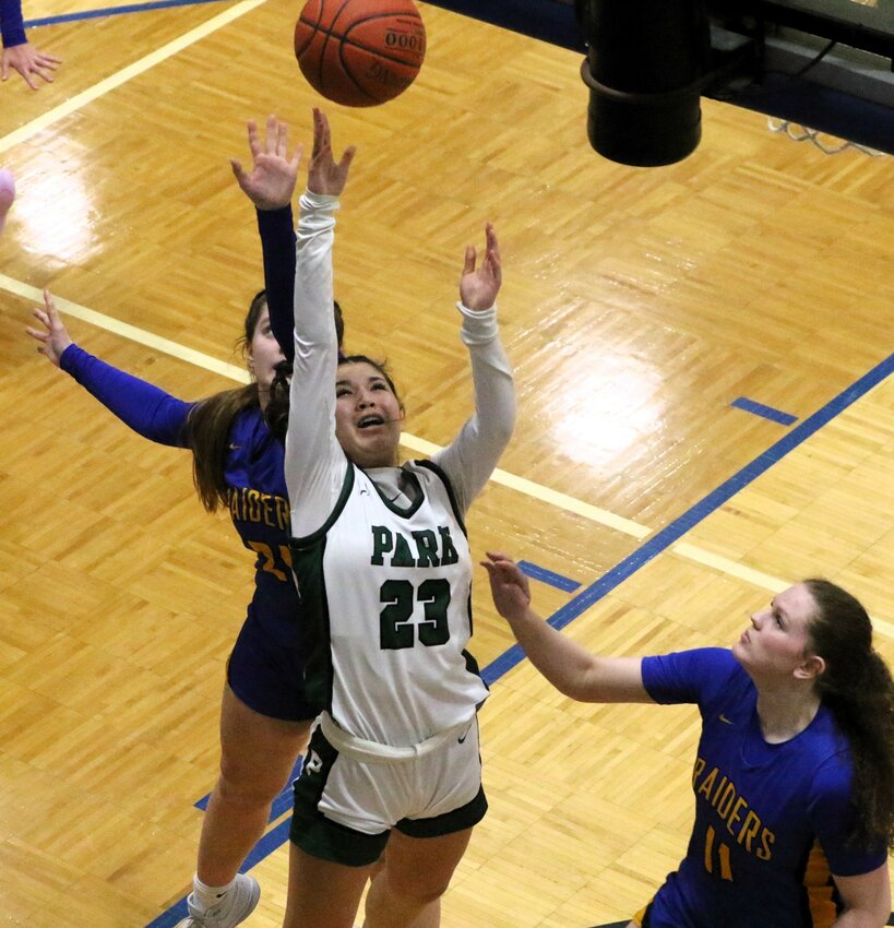 Sophomore guard Tea Alvarenga splits a pair of Hastings defenders for a close in shot.