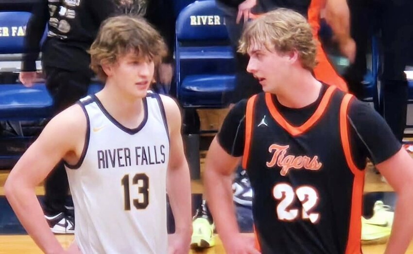 Cousins Austin Stellrecht (left) and Nick Stellrecht (right) were guarding each other during Friday night's Region Semi-Final boys basketball game in River Falls.