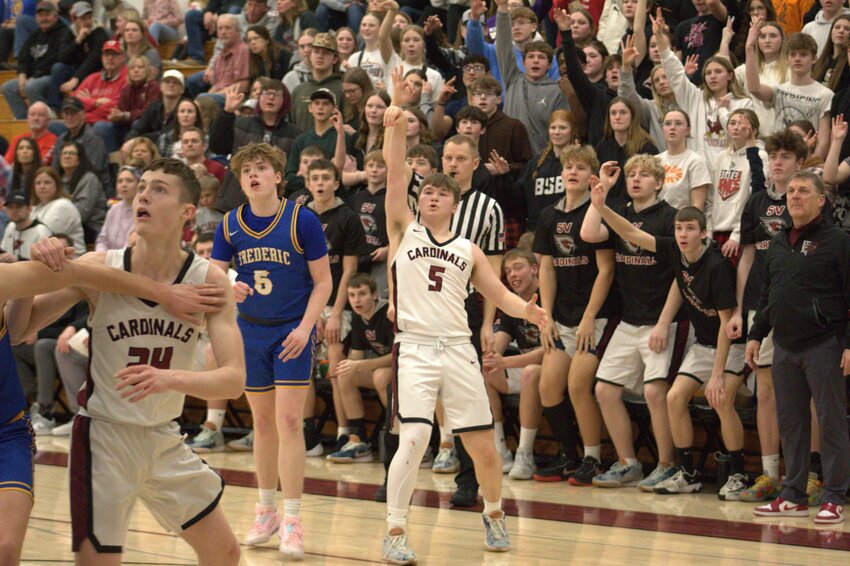 Trevor Forster fires a three in front of a packed student section during the Regional Championship on March 8.