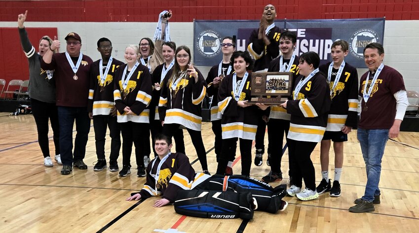 A happy bunch of South Washington County Thunderbolts pose for photos after a dramatic 10-9 overtime win in the third-place game at state.