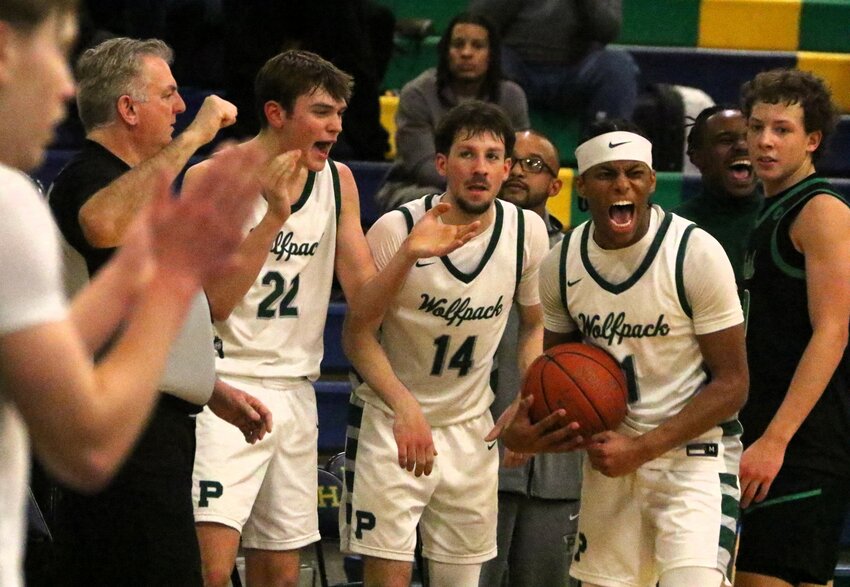 Park senior guard Anthony Giadyu gets a lift from teammates post-game after breaking the 1,000 points scored mark.