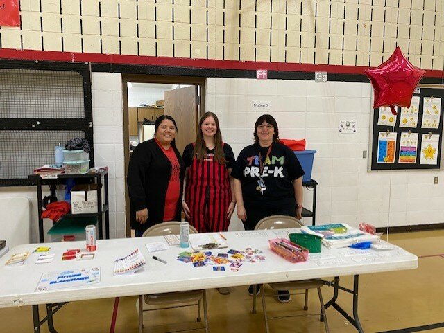 Greeting parents and children were Deisy Gonzalez, Lydia Van Ark and Jodi Kaduce .
