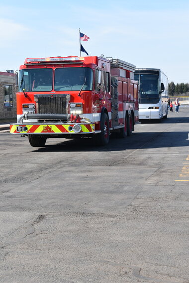 The basketball team was escorted from the school by the fire department as they headed to the state basketball tournament Thursday.