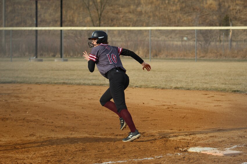 Junior Evah Butts swipes second base in a 14-9 loss to Turtle Lake/Clayton.