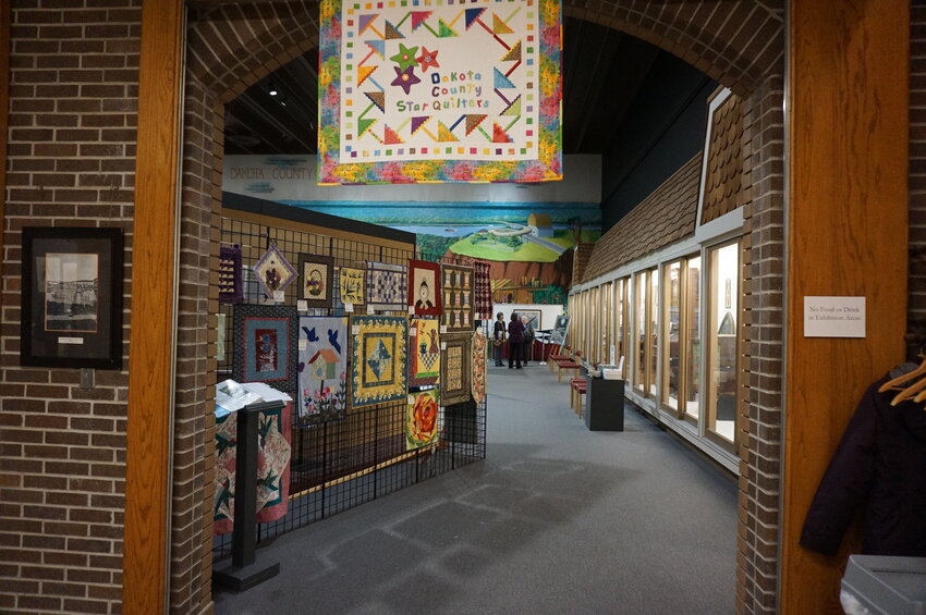 Presenter Sue Heinz spoke to her “friend named Elmer” in a presentation to the Dakota County Star Quilters highlighting the use of Elmer’s glue in quilting.