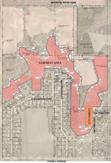 An easement for the possible extension of mountain bike trails from Whitetail Ridge Park.