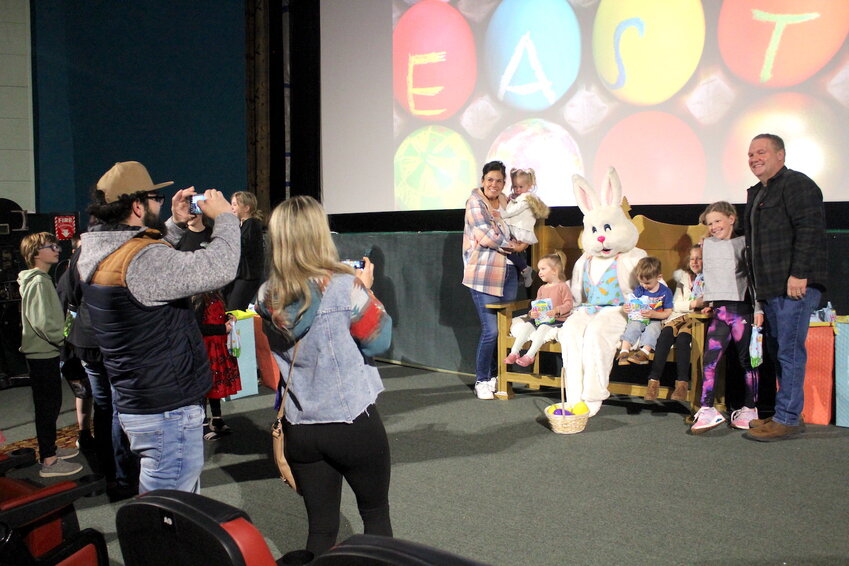 The Stanley Theater once again welcomed theatergoers to the Easter Free Show Saturday, April 19, with show sponsors including the Stanley Area Chamber of Commerce, Haas Inc., and Kromrey Chiropractic. Among those taking a picture with the Easter bunny were (from left) Jenny Shilts, Aurora Shilts, Wren Shilts, Teddy Von Haden, Lola Shilts, Ella Shilts, and Monte Shilts. In the left foreground are Joe and Josie Shilts. See inside on page 3 for more theater news.