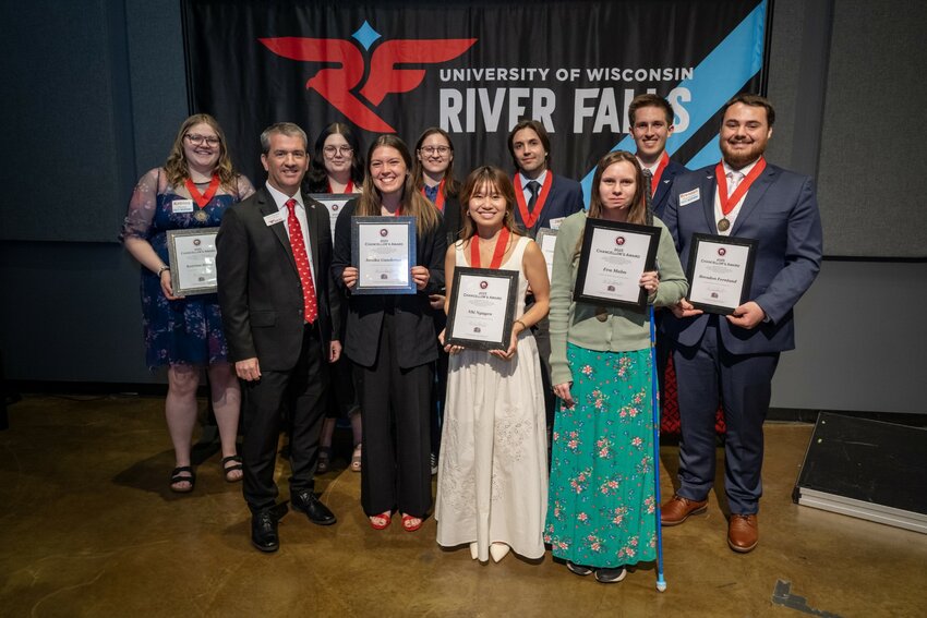 Nine UW-River Falls students were awarded the Chancellor&rsquo;s Award for Students during a banquet and ceremony on campus Wednesday. (Front, from left)): Interim Chancellor John Chenoweth, Annika Gunderson, Nhi Nguyen and Eva Malm; (back, from left): Katrina Steele, Em Murray, Cassie Christian, Jack Schindler Van Hoof, Sasha Resig and Brendan Fernlund.