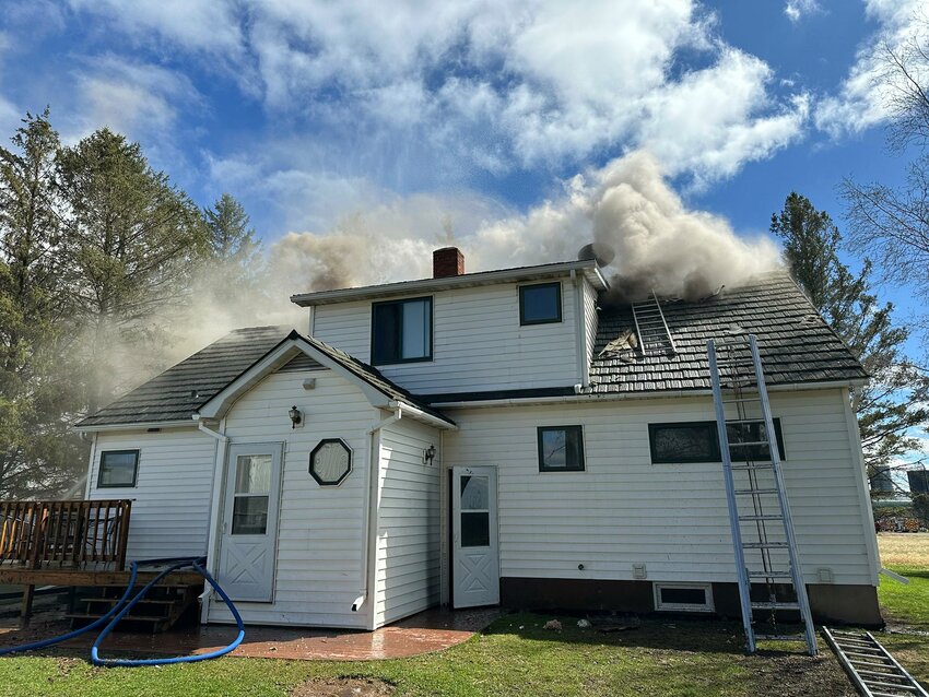 Smoke coming from the attic at residential fire on Mico Dr.