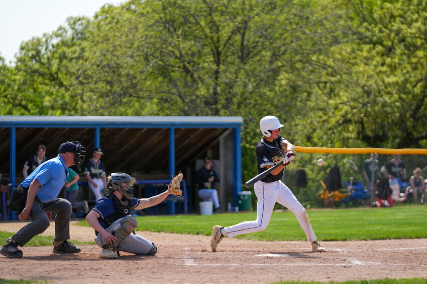 Hastings Hawks shortstop Kelin Rasmussen squares up a pitch during Saturday's season-opening win against Ellsworth. Rasmussen contributed both at the plate and in the field, driving in a run and making a highlight-reel play early in the game.