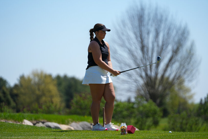 Senior Madison Haines drives from the 15th tee at Emerald Greens, leading the Raiders with a team-best 90 during Thursday’s meet that featured several of the state’s top teams.