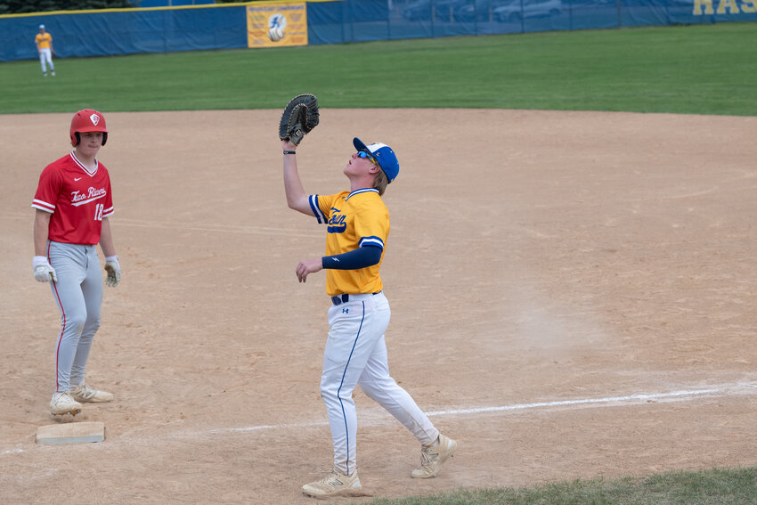 Drew Gillespie chases down a bunt early in the game against the Warriors.