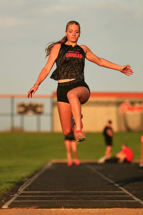 Macie LaGrander in the Long Jump at Stanley-Boyd Friday. LaGrander jumped 17-4 to place first.