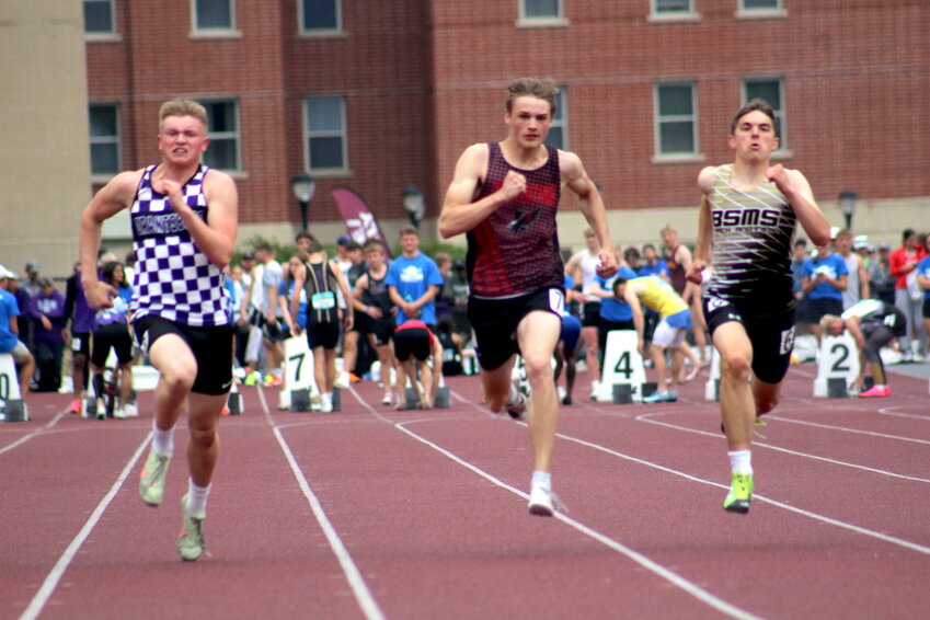 Brandon Geldernick of Owen-Withee (center) competes in the 100 meter dash on Friday, June 6 at La Crosse. Geldernick finished 14th in the 100 meter preliminary round with a time of 11.40. Geldernick qualified for finals in the 200 meter, finishing 10th in the preliminary round with a time of 22.49, placing eight in the 200 meter final with a time of 22.45.