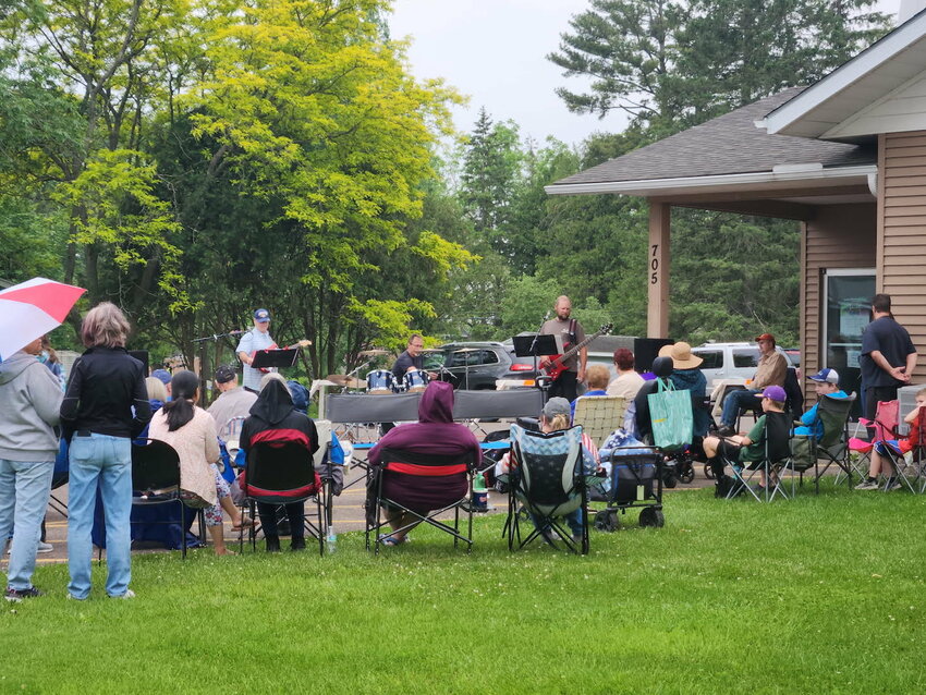 Hometown Revival leads an evening of worship in the Faith Evangelical Free Church parking lot located at 705 Madison Street in Stanley.