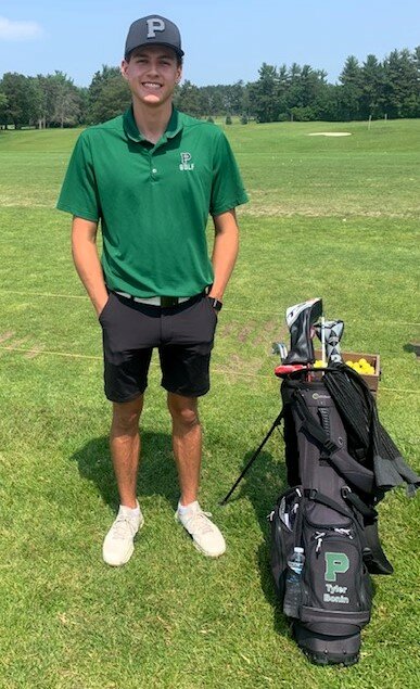 Tyler Bonin aims for the green in the state meet at Bunker Hills Golf Course.